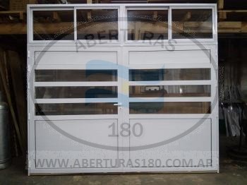 Frente de vidriera en aluminio herrero c/ paos fijos laterales, puerta c/divisin, ventana de abrir y ventana corrediza superior c/mosquitero.